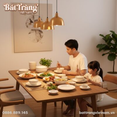 Một gia đình trẻ Việt Nam đang dùng bữa tối ấm ...