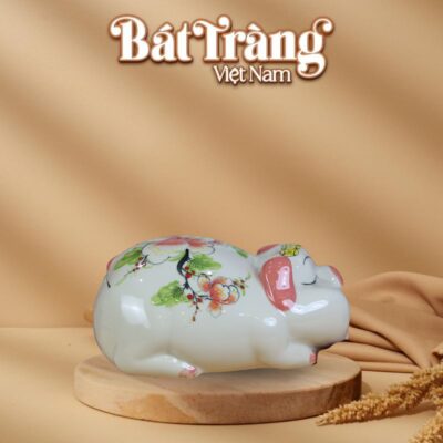 Ống tiết kiệm heo phệ mắt hip nằm màu trắng hồng BT-HĐ07