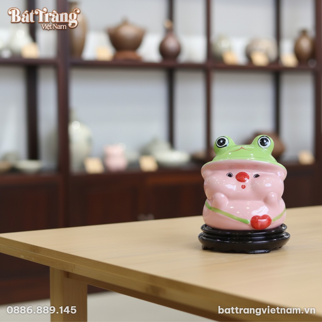 Ống tiết kiệm b&eacute; heo hồng mũ ếch bằng gốm sứ B&aacute;...