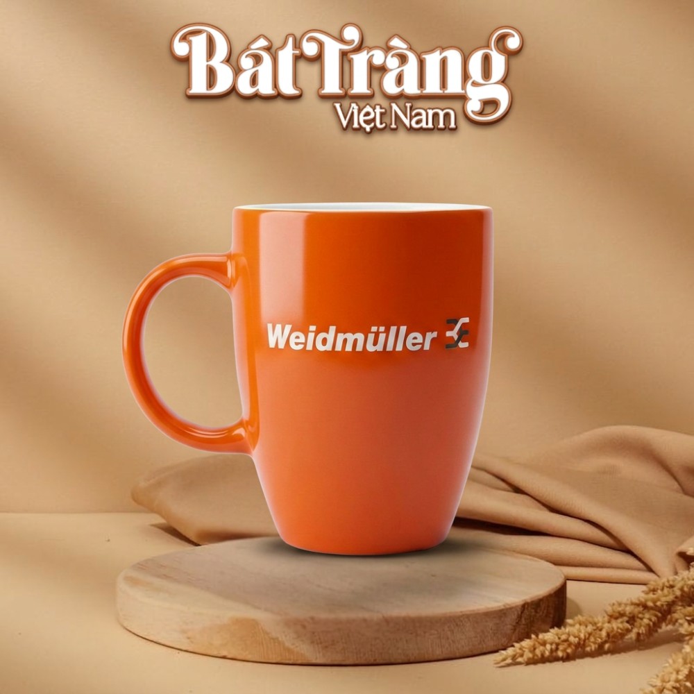Ly sứ in logo cao quai C in logo lam qu&agrave; tặng Bt-QT120